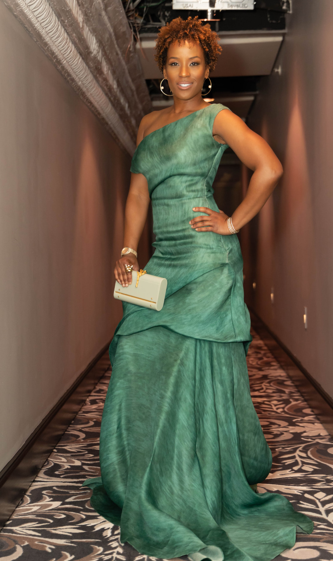 Megan Rivers in a green gown hosting the Dream Big Awards