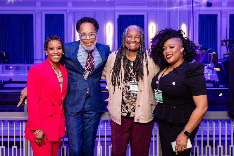Megan Rivers with industry leaders at an annual meeting
